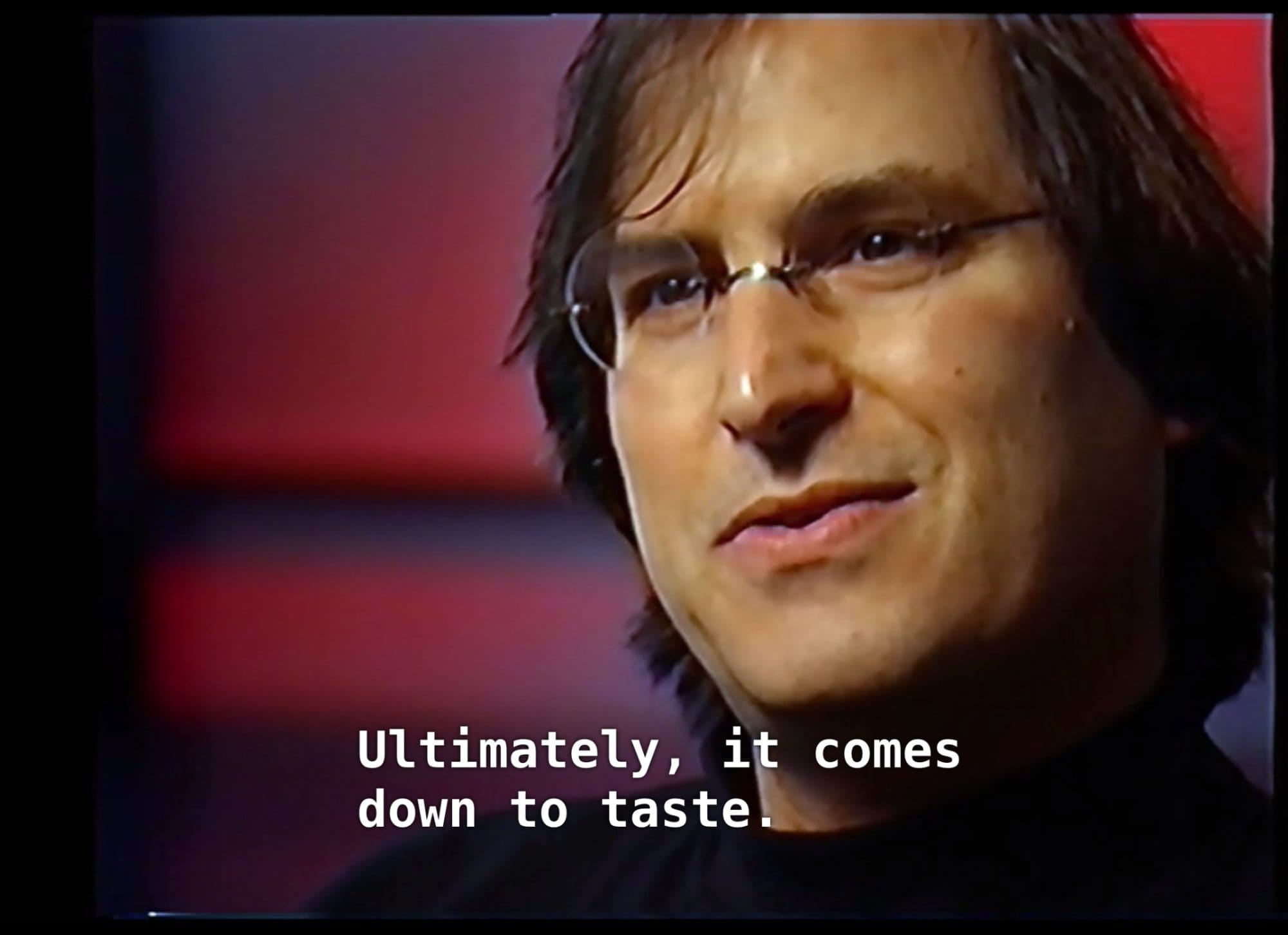 A still of Steve Jobs in a 1990s television interview, subtitled “Ultimately, it comes down to taste.”